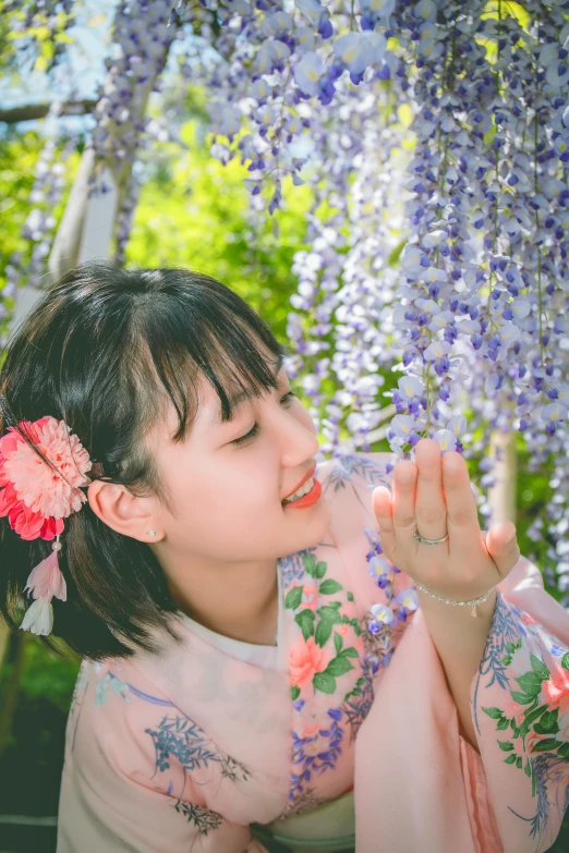 a little girl with a flower in her hair, a picture, by Torii Kiyomoto, unsplash, portrait of mayuri shiina, 🚿🗝📝, emanating magic from her palms, a cute young woman