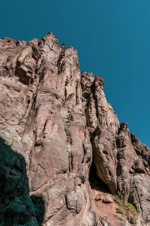 a group of people climbing up the side of a mountain, by Breyten Breytenbach, les nabis, tucson arizona, tall stone spires, hyper - detailed color photo, panoramic
