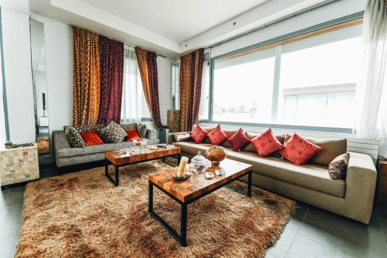 a living room filled with furniture and a large window, inspired by Riad Beyrouti, unsplash, red brown and grey color scheme, wide - angle view, apartment, mongolia