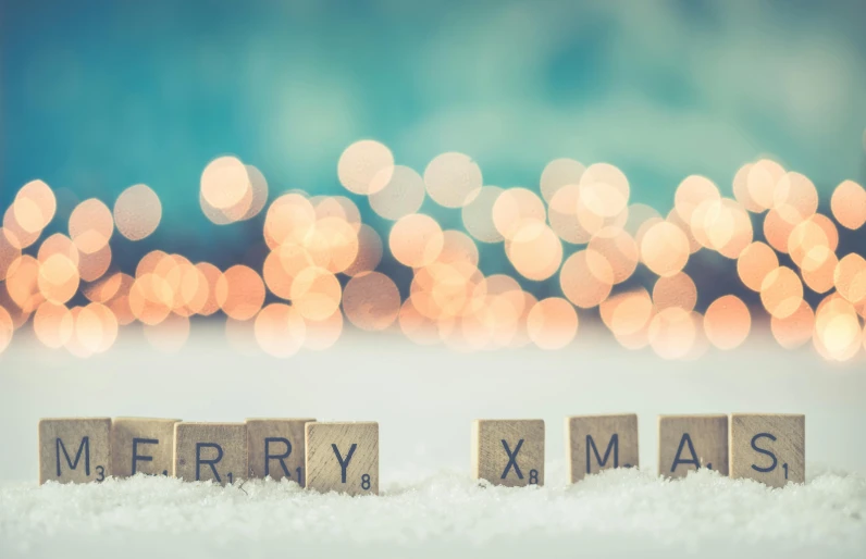 wooden blocks spelling merry xmas with lights in the background, a picture, by Emma Andijewska, shutterstock, square, snowy, very tiny, bryan sola