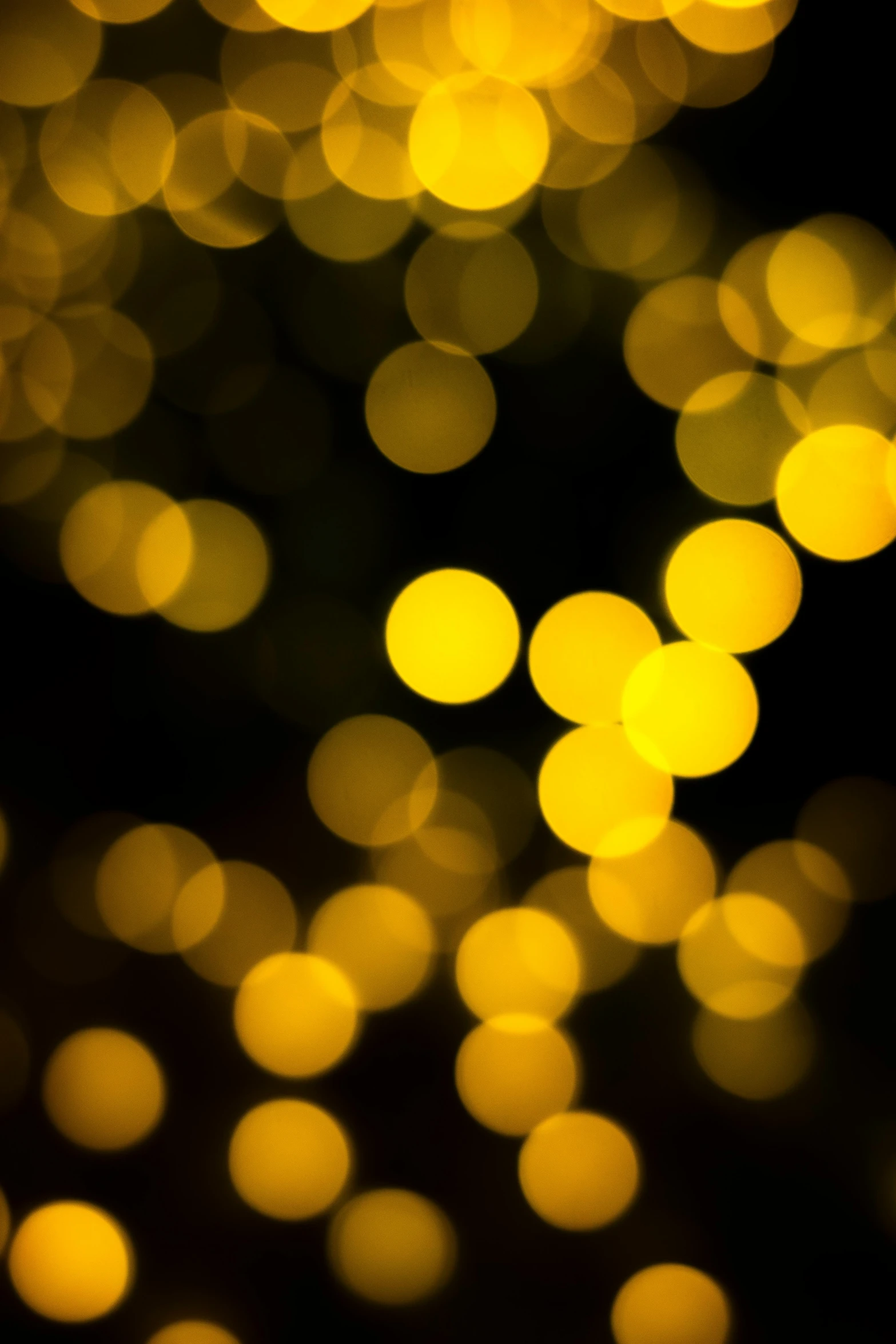 a bunch of yellow lights on a black background, pexels, overcast bokeh - c 5, holiday, - n 9, by greg rutkowski