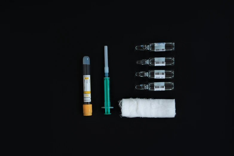 a toothbrush, a tube of toothpaste, a tube of toothpaste and a tube of toothpaste on a black background, by Jan Rustem, plasticien, surgical iv bag, syringe, ingredients on the table, overdose