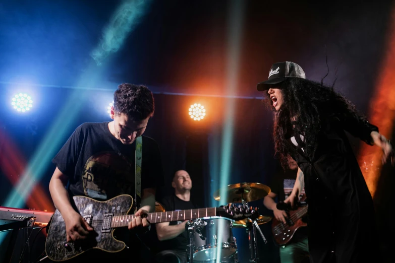 a group of people playing guitars on a stage, pexels contest winner, antipodeans, buckethead, avatar image, focused photo