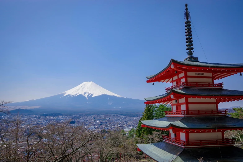 a pagoda with a mountain in the background, inspired by Kanō Hōgai, pexels contest winner, city buildings on top of trees, avatar image, fuji choko, 2 0 2 2 photo