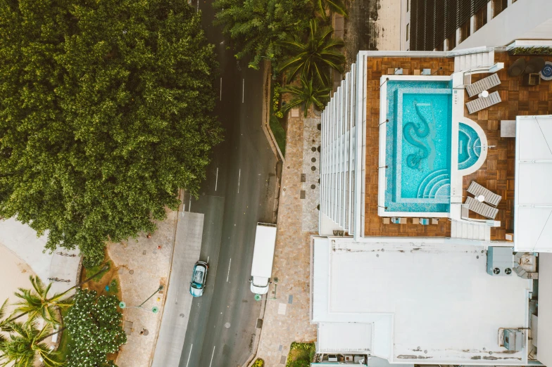 an aerial view of a house with a swimming pool, pexels contest winner, street art, puerto rico, aerial photograph of skyscraper, instagram story, car shot