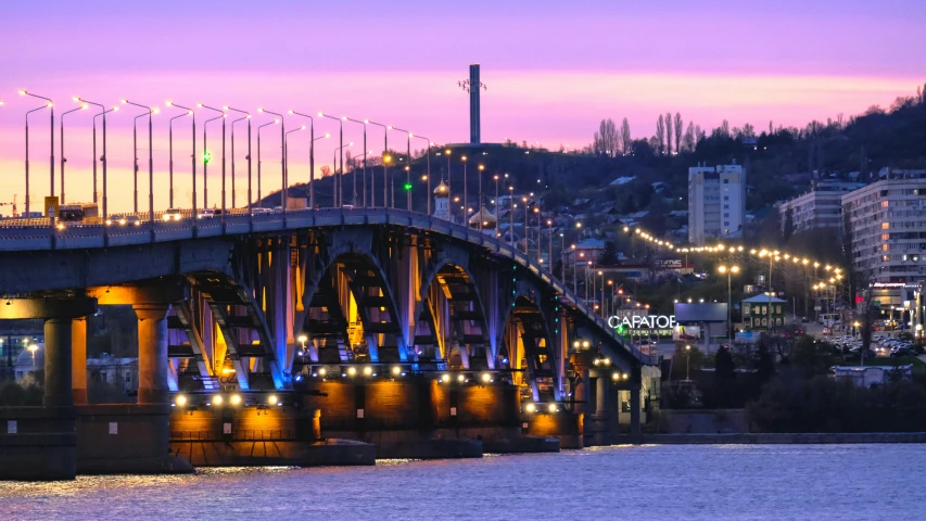 a bridge over a large body of water, pexels contest winner, art nouveau, neo kyiv, purple and yellow lighting, spring evening, brown