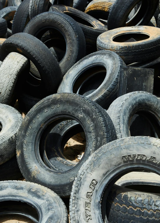 a pile of tires sitting on top of a pile of dirt, thumbnail, 10k, decorative, soft rubber