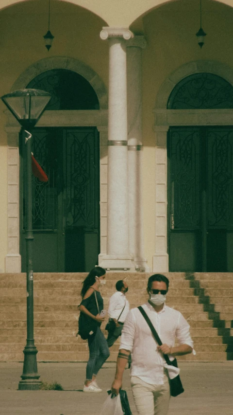 a group of people walking in front of a building, by Pablo Rey, pexels contest winner, renaissance, wearing facemask, puerto rico, lo-fi, agrigento