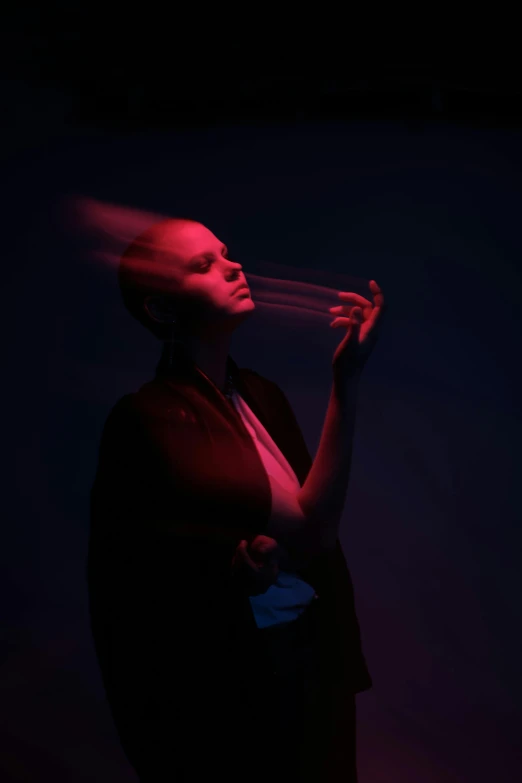 a man smoking a cigarette in a dark room, an album cover, inspired by Anna Füssli, unsplash, neo-figurative, a woman holding an orb, profile pose, showstudio, wisps of energy in the air