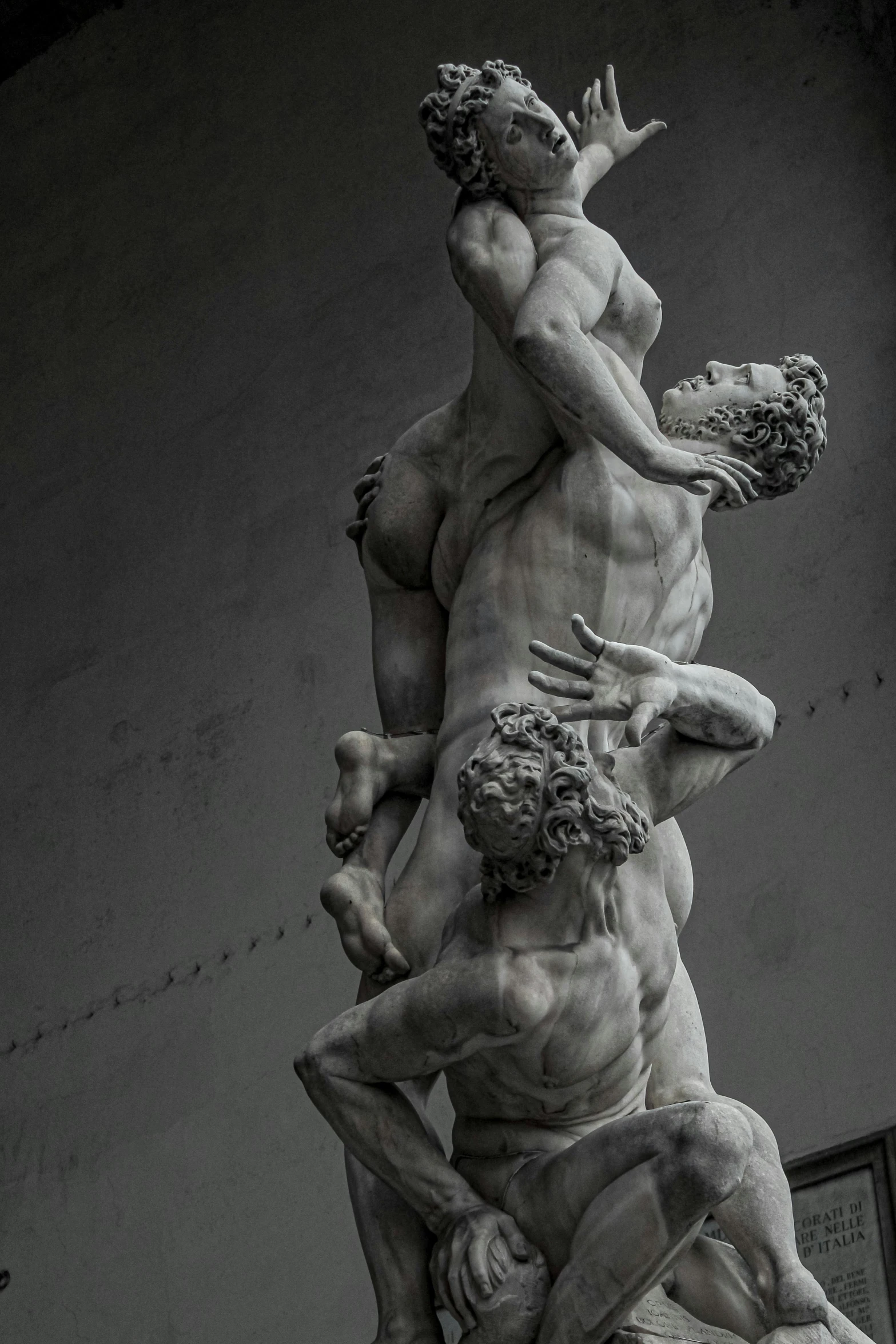 a black and white photo of a statue, by Michelangelo, pexels contest winner, two muscular men entwined, brutal archi, vore, photos