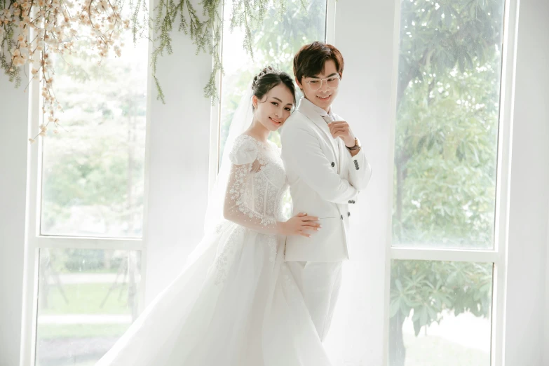 a man in a white suit standing next to a woman in a white dress, inspired by Kim Du-ryang, pexels contest winner, wearing a wedding dress, cai xukun, square, white bg
