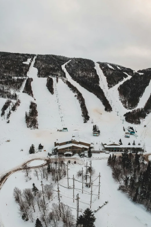 an aerial view of a ski resort in the mountains, lynn skordal, slight overcast lighting, 2019 trending photo, flatlay