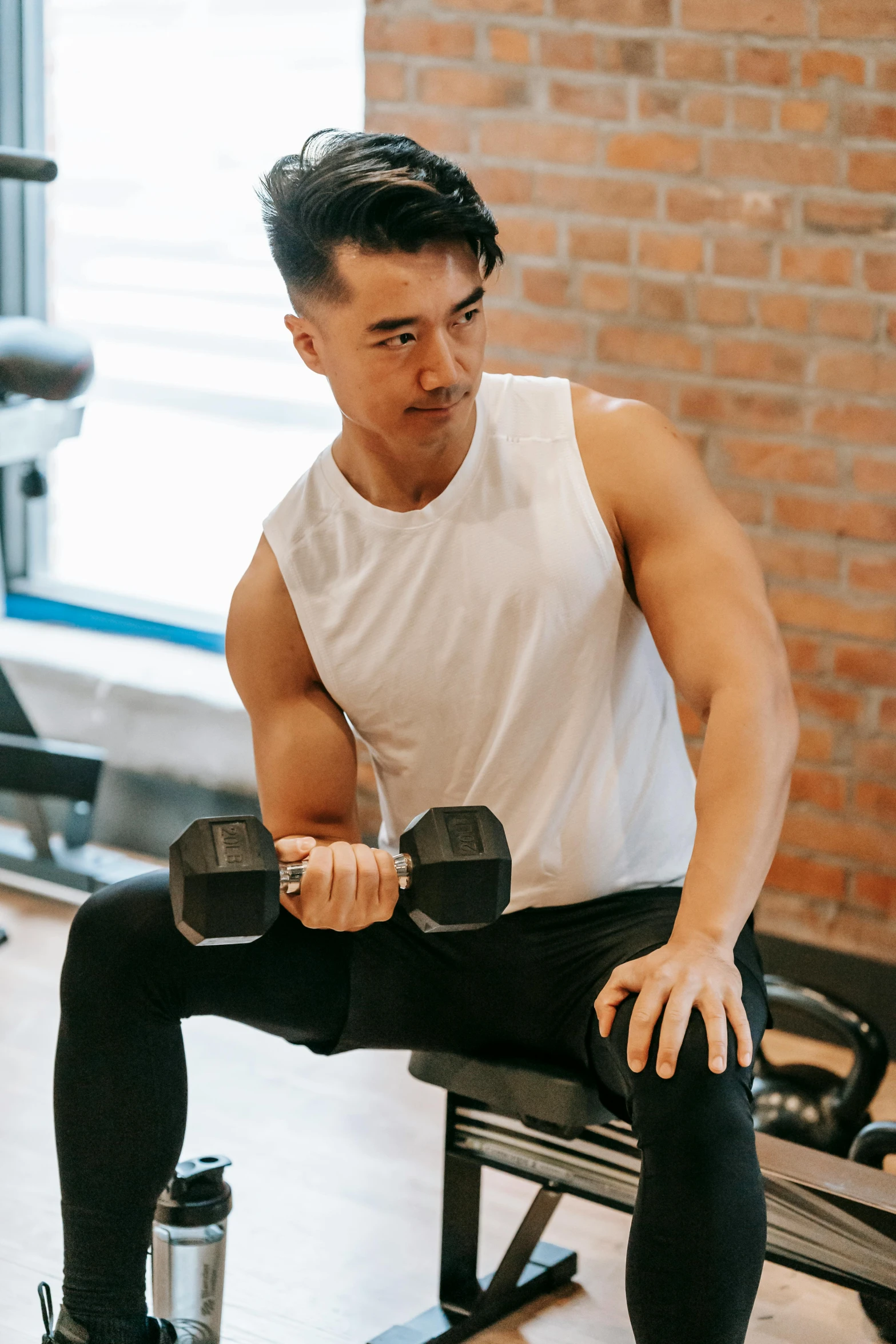 a man sitting on a bench with two dumbbells, pexels contest winner, down left arm and back, ryan jia, henry ascensio, profile image