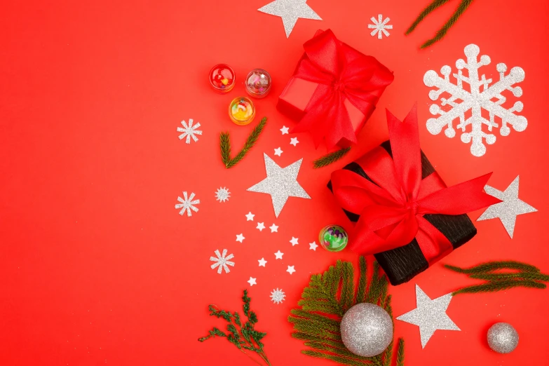 christmas decorations on a red background with stars and snowflakes, pexels contest winner, hurufiyya, background image, flat lay, bows, alternate angle