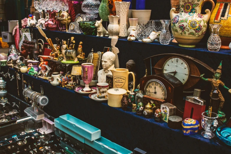 a table topped with lots of different types of vases, by Joe Bowler, unsplash, maximalism, some stalls, figurines, inspect in inventory image, mid night