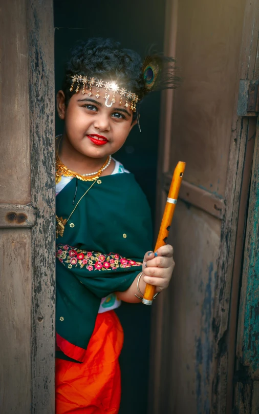 a little girl that is standing in a doorway, inspired by Steve McCurry, pexels contest winner, young girl playing flute, diverse costumes, 15081959 21121991 01012000 4k, a handsome