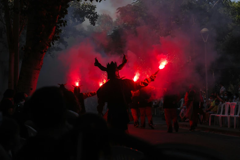 a group of people that are standing in the street, flares, black horns, andrzej sykut, tournament