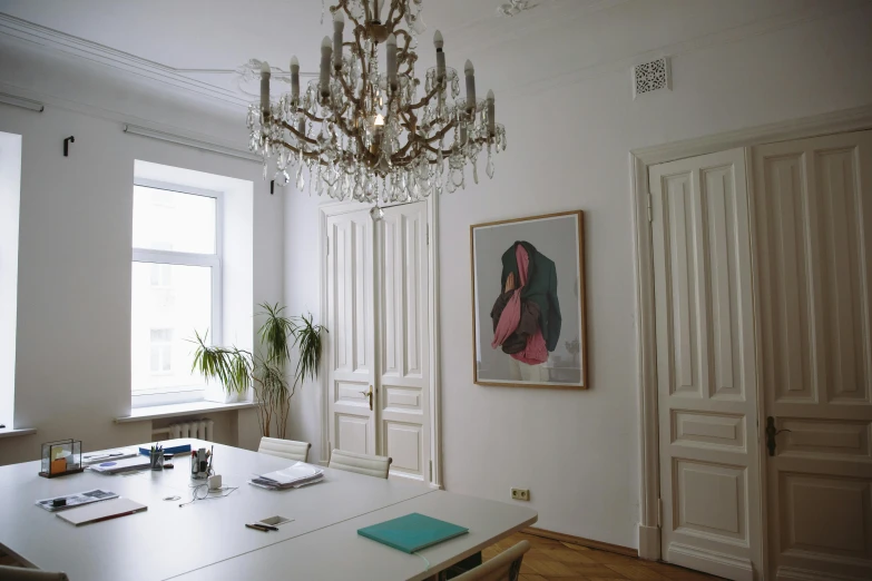 a room with a table, chairs and a chandelier, a painting, unsplash, arbeitsrat für kunst, in office, khreschatyk, real image, portrait no. 1