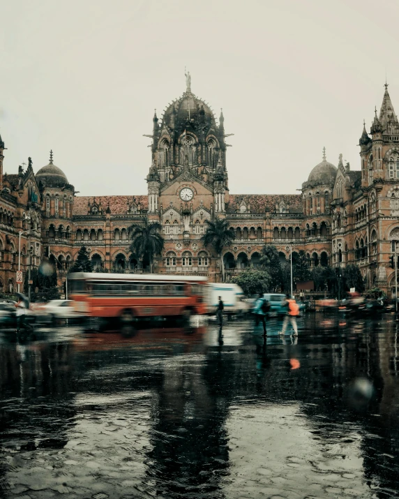 a large building with a clock tower on top of it, pexels contest winner, art nouveau, streets of mumbai, rainy environment, lgbtq, background image