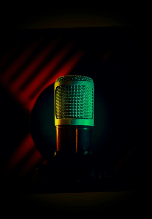 a close up of a microphone in a dark room, an album cover, pexels, pop art, red green yellow color scheme, #green, brown, single light