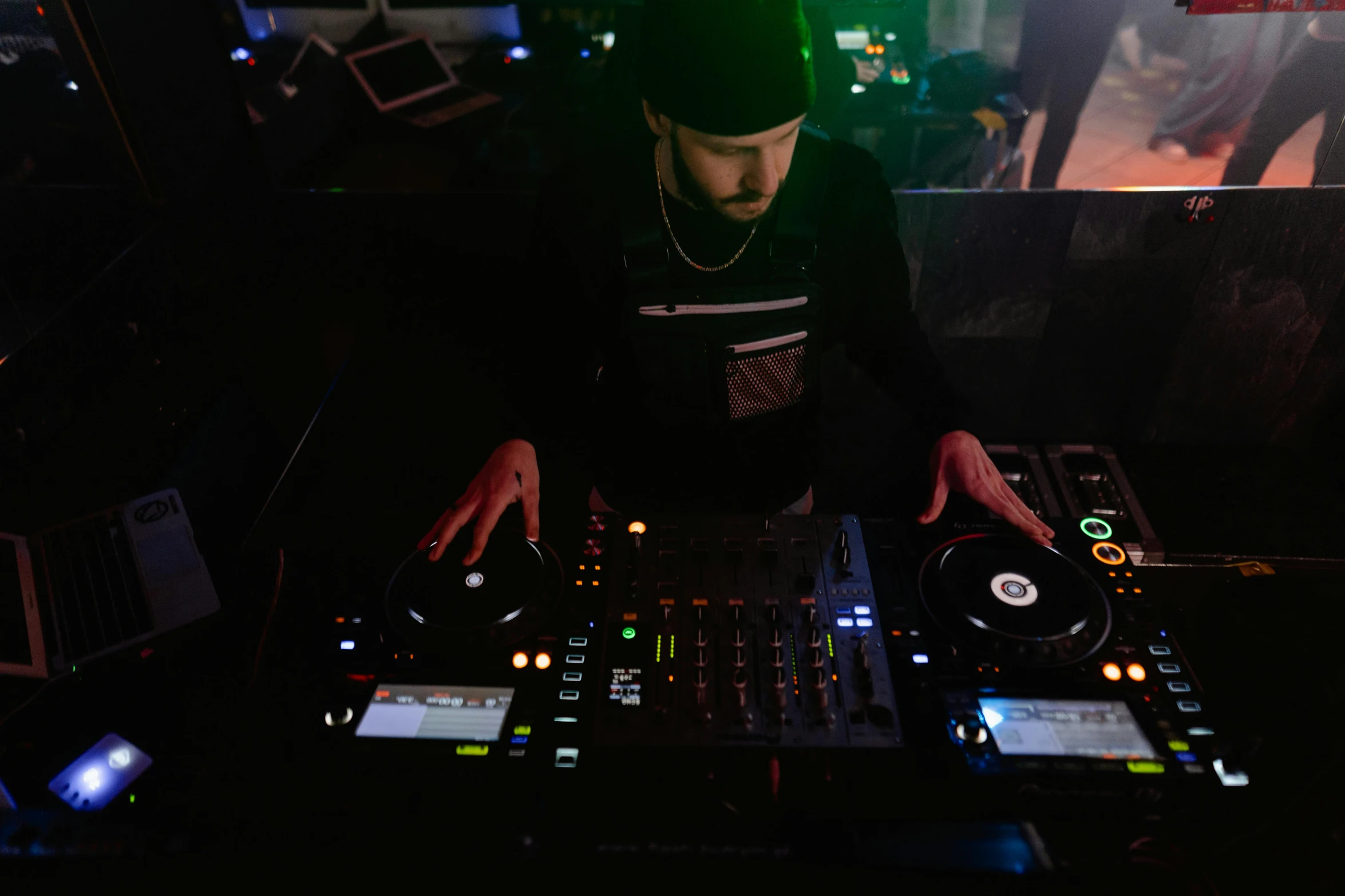 a man that is standing in front of a mixer, unsplash, private press, clubs, lit from above, high quality photo, sitting down