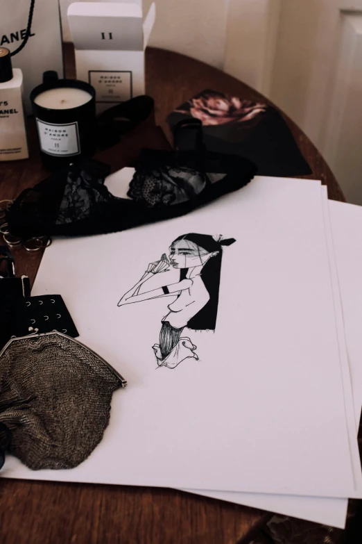 a table that has a bunch of items on it, an ink drawing, by Hannah Frank, serial art, seductive lady, low quality photo, witchy clothing, trending photo