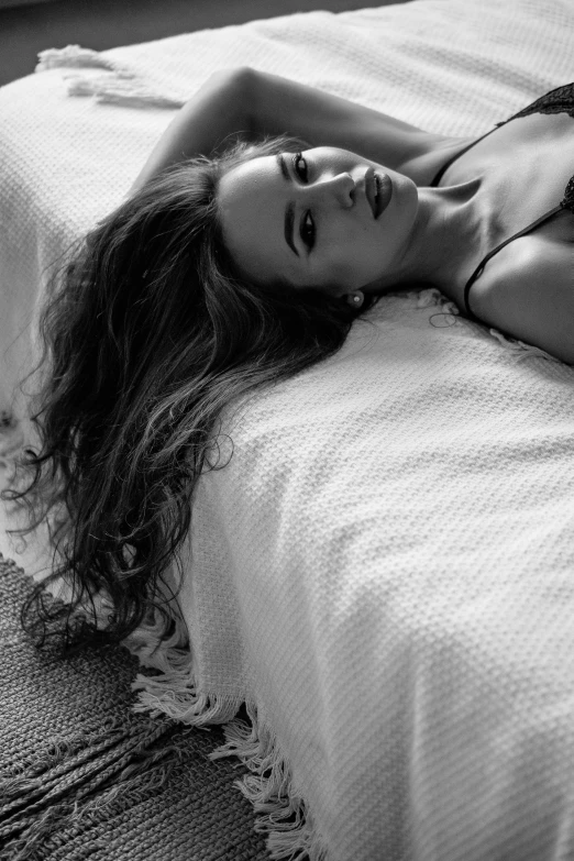 a black and white photo of a woman laying on a bed, by Felix-Kelly, chloe bennet, j - lo, promo image, summer evening