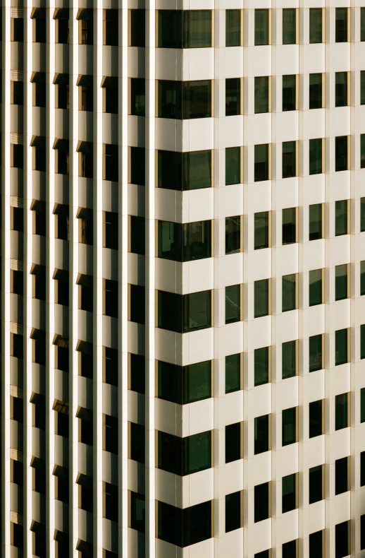 a clock mounted to the side of a tall building, inspired by Andreas Gursky, modernism, photograph from above, golden windows, seattle, 1999 photograph