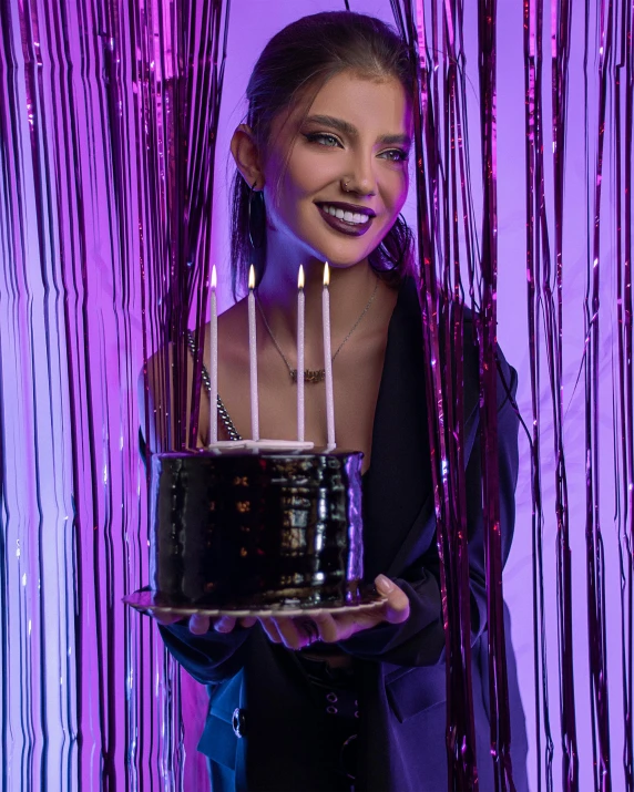 a woman holding a cake with candles on it, an album cover, by Julia Pishtar, trending on unsplash, holography, barbara palvin, made of liquid purple metal, wearing black clothes, happy birthday candles