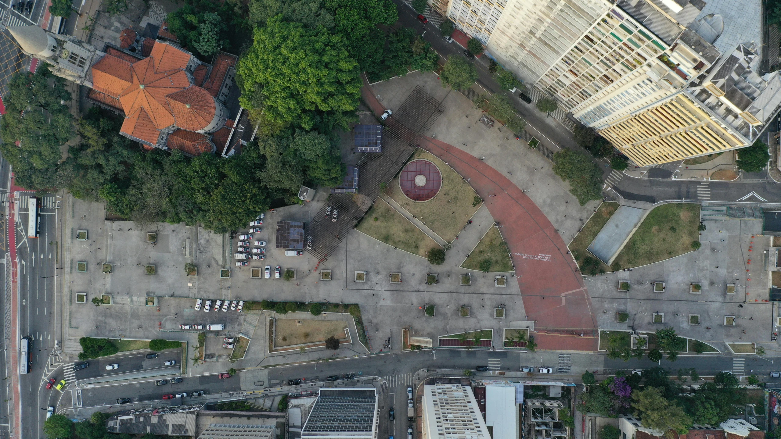 an aerial view of a city with lots of buildings, by Alejandro Obregón, unsplash contest winner, realism, sunken square, são paulo, in a city park, post - soviet courtyard