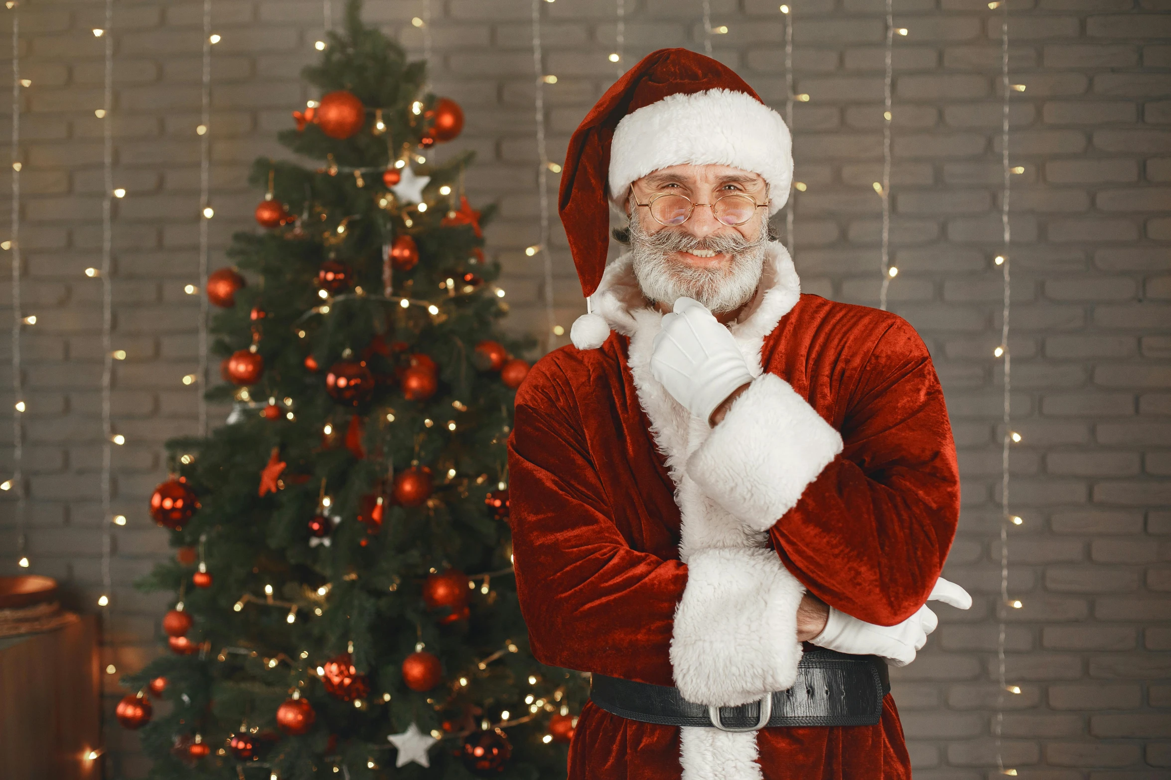 a man dressed as santa claus standing in front of a christmas tree, a portrait, pexels, jean luc picard, wholesome, to, professional cgi