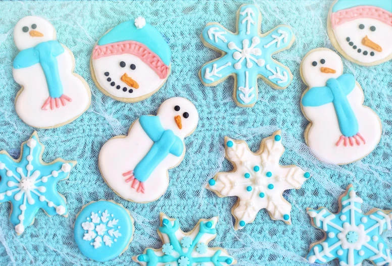 cookies decorated like snowmen and snowflakes, a pastel, by Nancy Spero, pexels, naive art, blue, 🕹️ 😎 🔫 🤖 🚬, epic stunning, guide