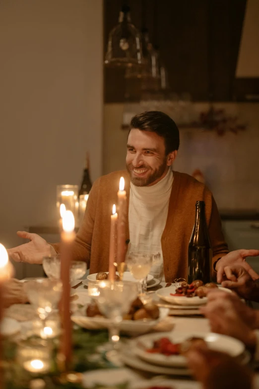 a group of people sitting around a dinner table, on a candle holder, handsome male, promo image, happy cozy feelings