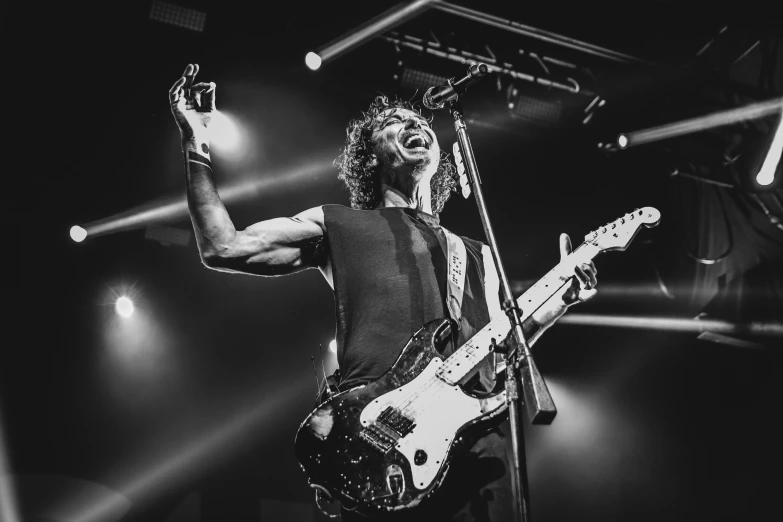 the foo foo foo foo foo foo foo foo foo foo foo foo foo foo foo foo foo, a black and white photo, by Dan Luvisi, robert sheehan, holding electric guitars, in a white tank top singing, instagram photo