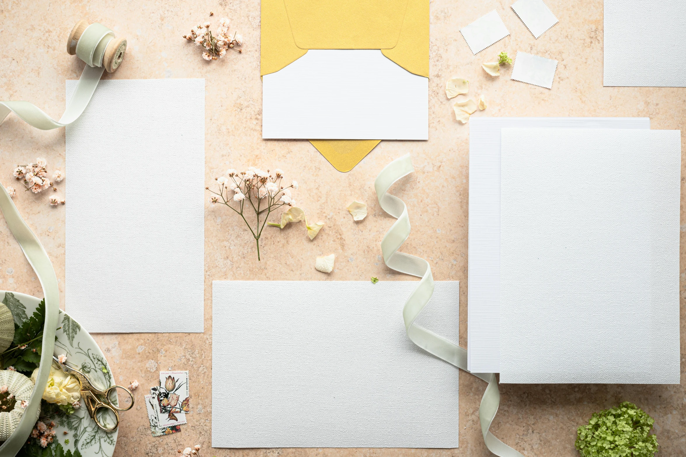 a bunch of papers sitting on top of a table, a still life, inspired by Eden Box, unsplash, private press, square shapes, wedding, on a pale background, writing a letter