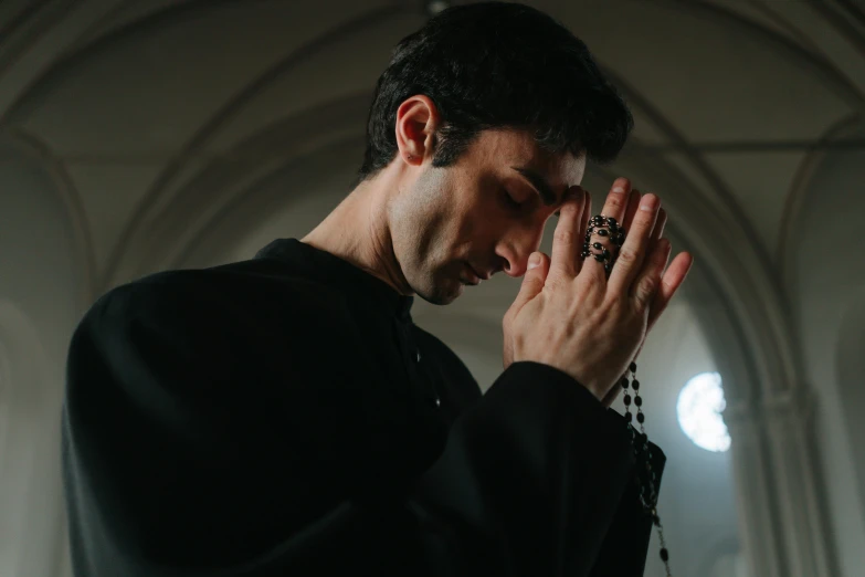 a man holding his hands to his face, a picture, by Adam Marczyński, pexels contest winner, renaissance, orthodox christianity, movie still from the matrix, middle eastern, right hand side profile