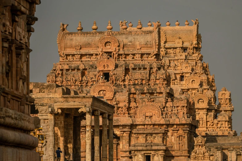 a group of people that are standing in front of a building, a detailed matte painting, by Peter Churcher, pexels contest winner, neoclassicism, hindu kovil scene, closeup - view, brown, buildings covered with greebles
