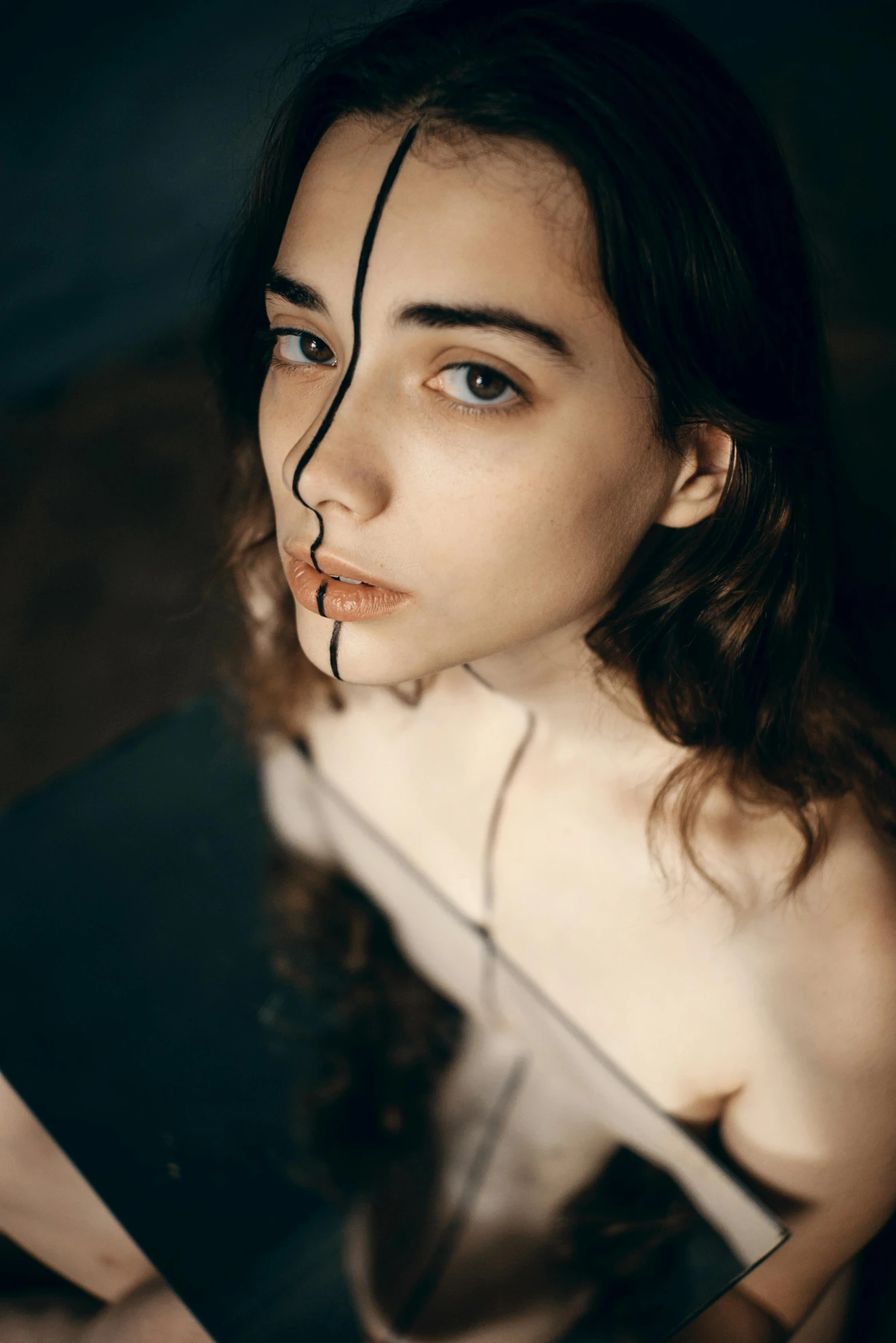 a woman sitting in front of a laptop computer, a photorealistic painting, inspired by Elsa Bleda, trending on pexels, surrealism, slender symmetrical face, scars on face, high angle closeup portrait, 5 0 0 px models