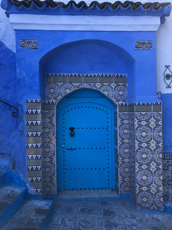 a blue and white building with a blue door, inspired by Alberto Morrocco, unsplash contest winner, tiled fountains, colorful ancient egyptian city, profile image