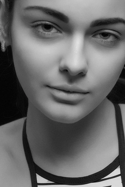 a black and white photo of a woman, a black and white photo, inspired by irakli nadar, trending on cgsociety, photorealism, closeup shot of face, 🤤 girl portrait, monochrome 3 d model, face is brightly lit