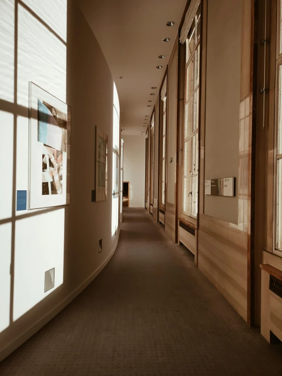 a long hallway with lots of windows next to each other, a photo, inspired by Constantin Hansen, museum display, trending on vsco, in the world of andrew wyeth, light source from the left