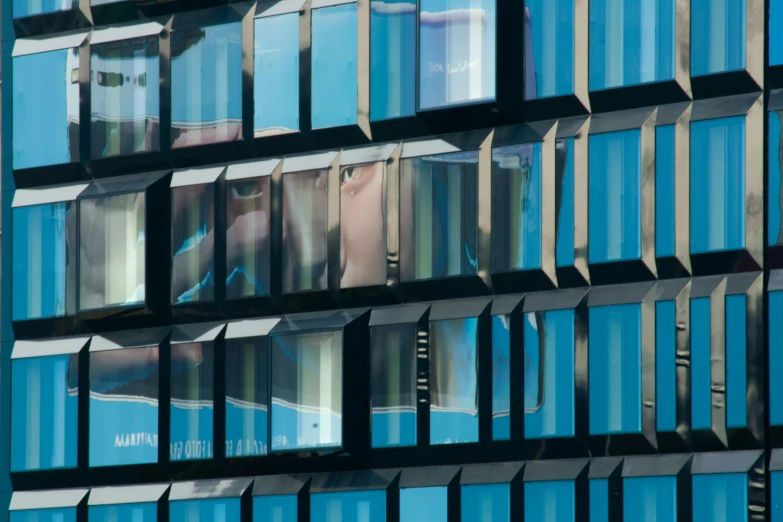 a close up of a building with many windows, by Sigrid Hjertén, blue reflections, people at work, slide show, thumbnail