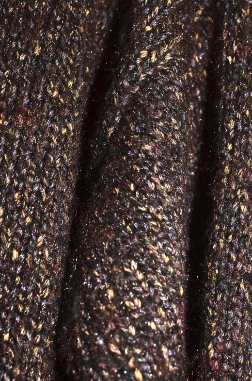 a close up of a sweater on a mannequin mannequin mannequin mannequin mannequin mannequin manne, inspired by Nyuju Stumpy Brown, trending on reddit, glossy flecks of iridescence, 8k fabric texture details, set in 1 8 5 0, dark brown duster