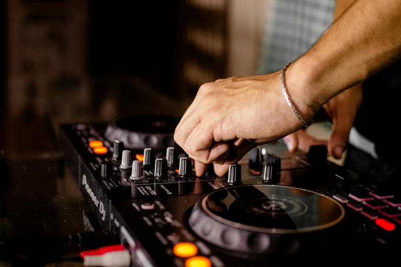 a close up of a person using a dj controller, trending on pexels, mixing drinks, sydney hanson, thumbnail, multiple stories