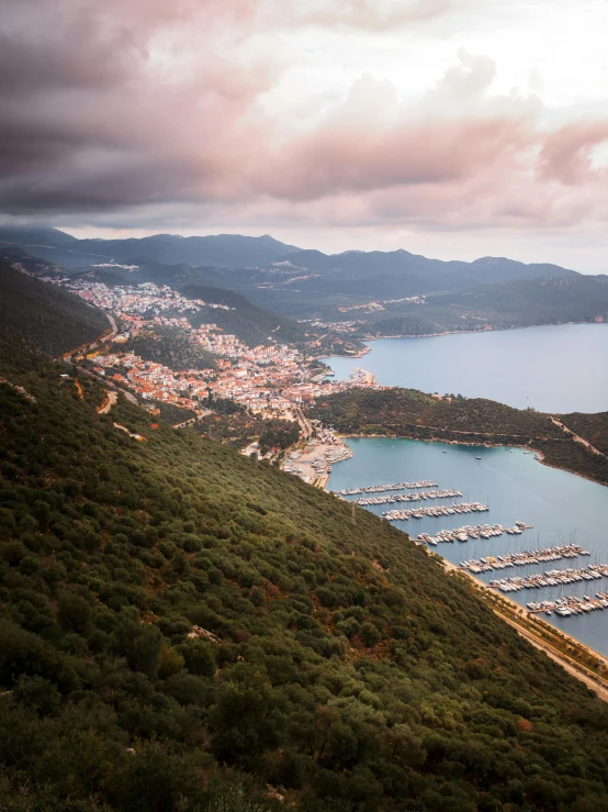 a large body of water sitting on top of a lush green hillside, by Sebastian Spreng, pexels contest winner, harbour, turkey, dramatic lighting from above, square