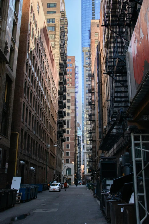 a city street filled with lots of tall buildings, location [ chicago ( alley ) ], extremely clear and coherent, opposite the lift-shaft, photograph taken in 2 0 2 0