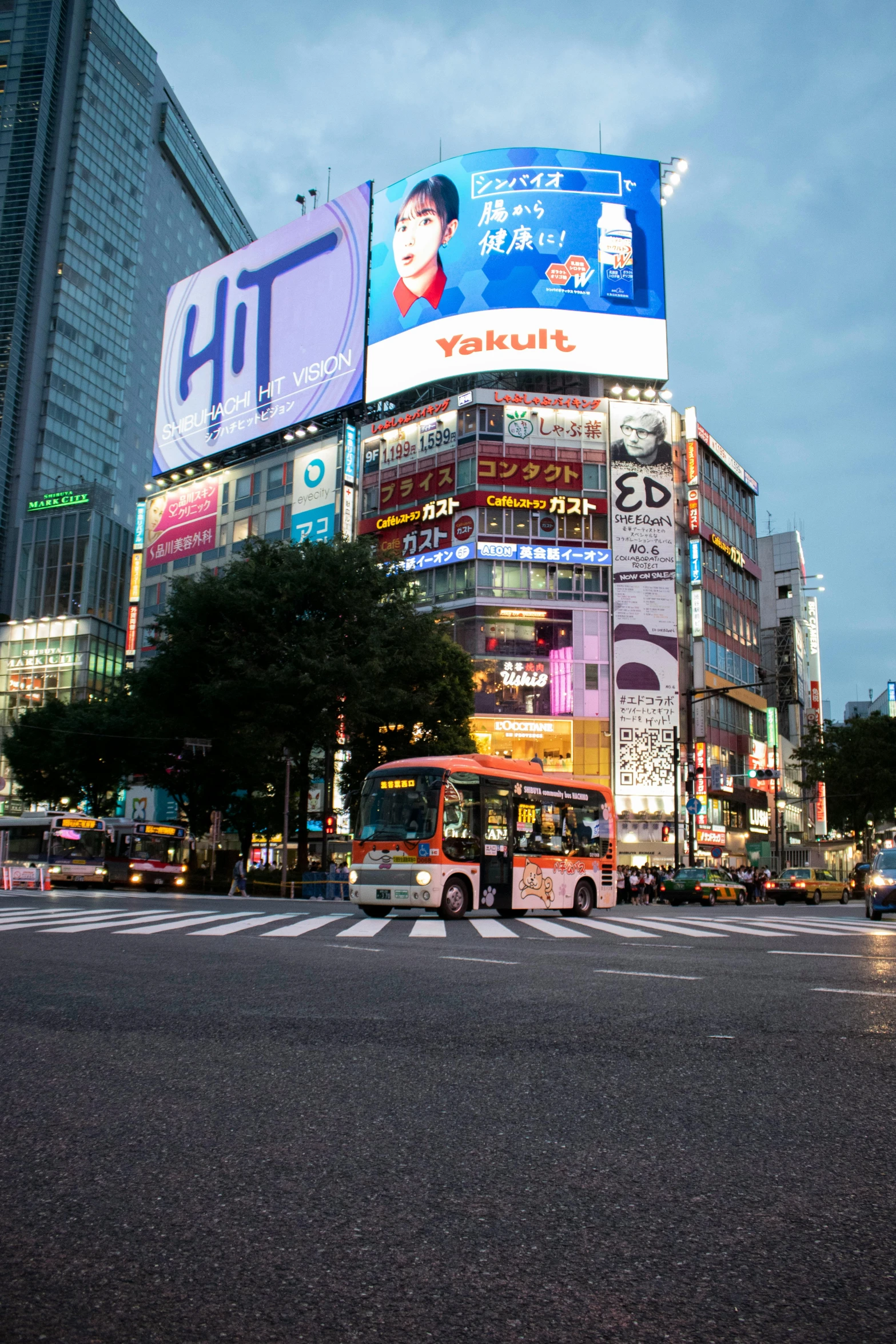 a city street filled with lots of traffic and tall buildings, a picture, shin hanga, billboard image, buses, square, led