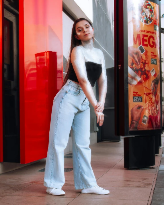 a woman standing in front of a vending machine, an album cover, by Cosmo Alexander, trending on pexels, holography, baggy jeans, portrait sophie mudd, standing in street, translucent skin