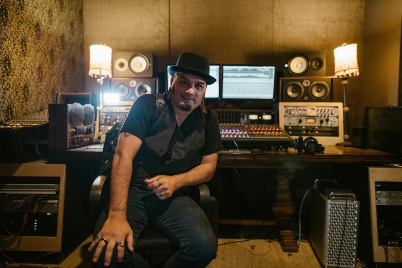 a man sitting on a chair in a recording studio, angie glocka, promotional image, tony matelli, jack black