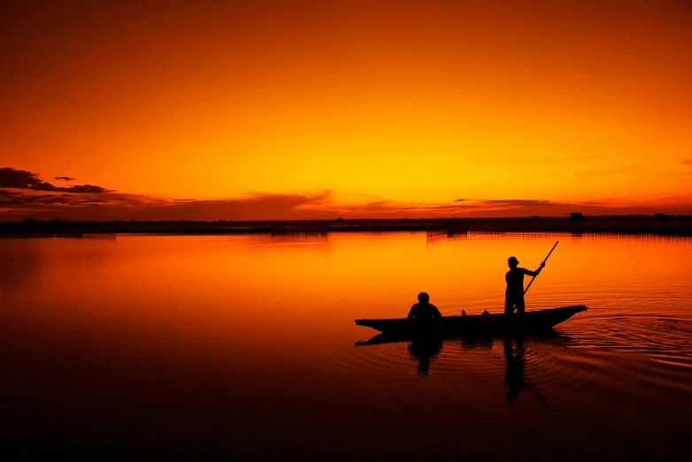 a couple of people that are in a boat, by Sudip Roy, pexels contest winner, romanticism, orange dawn, fishing, wallpaper hd, in an african river